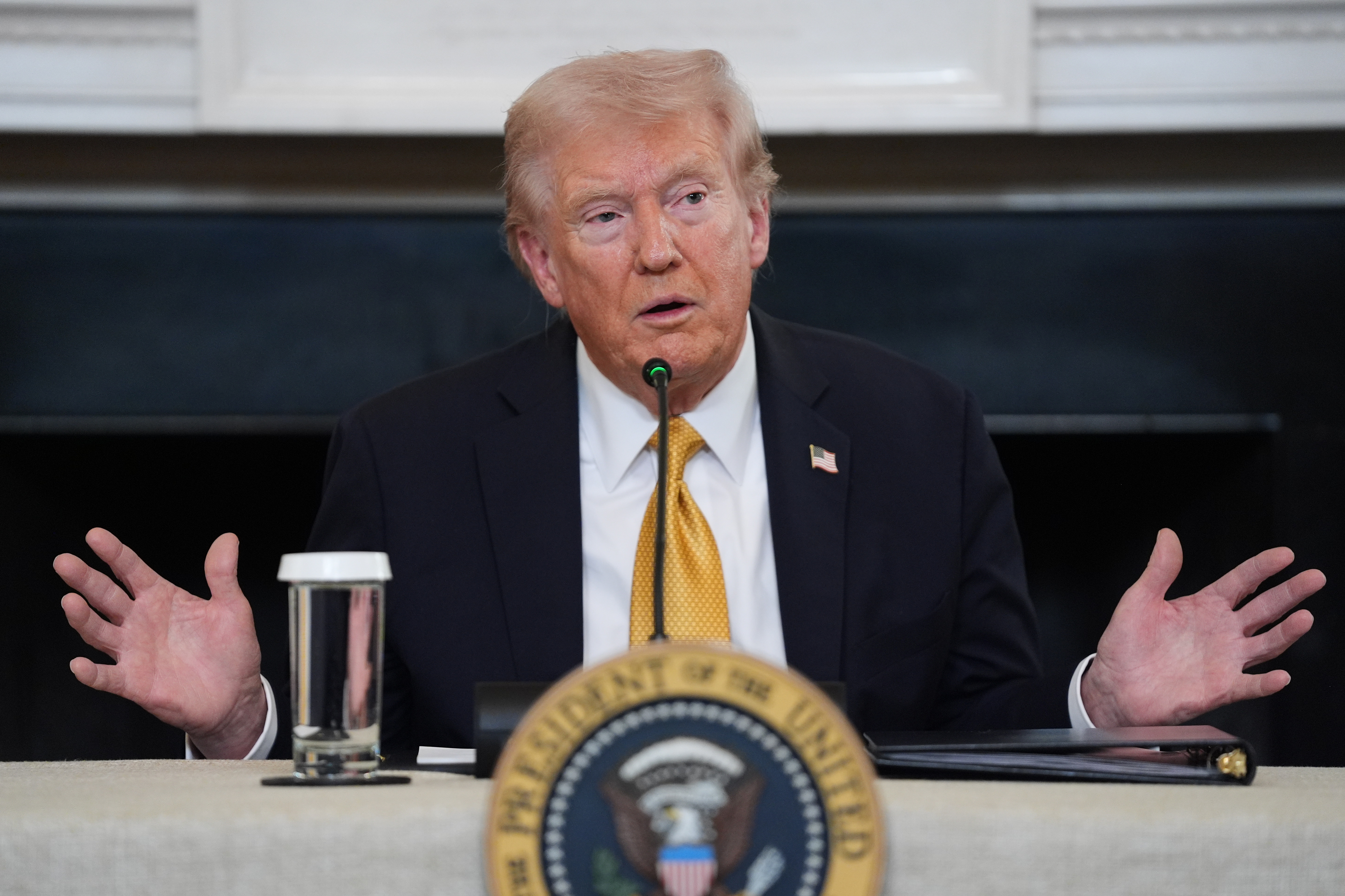 President Donald Trump answers questions from reporters during a roundtable on criminal cartels in the State Dining Room of the White House, Thursday, Oct. 23, 2025, in Washington.